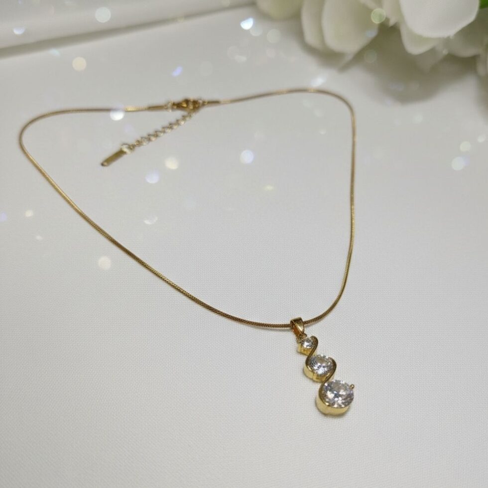 Elegant Triple Stone Curved Crystal Pendant Necklace with Gold Finish